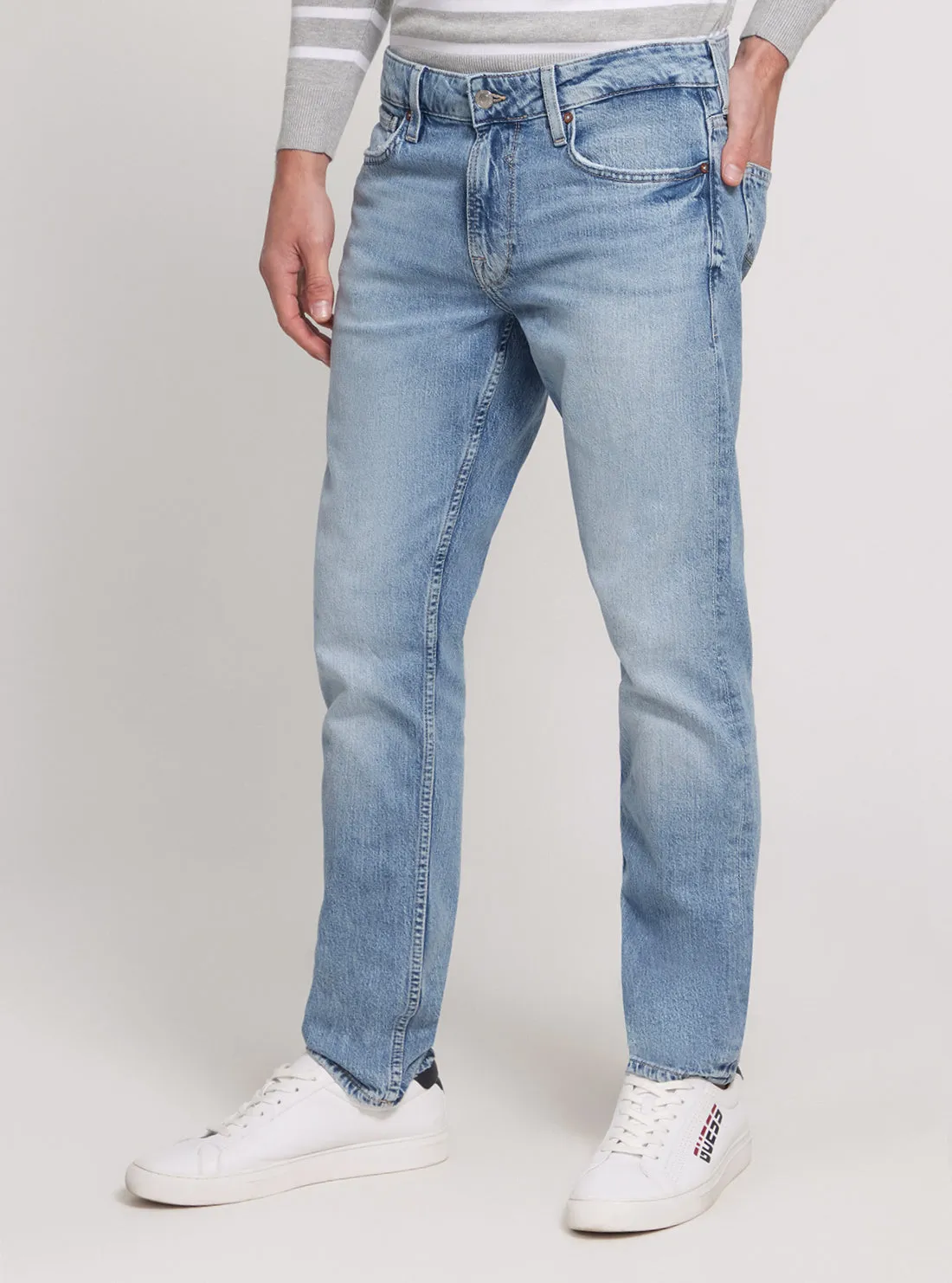 Low Rise Slim Tapered Denim Jeans in Light Wash