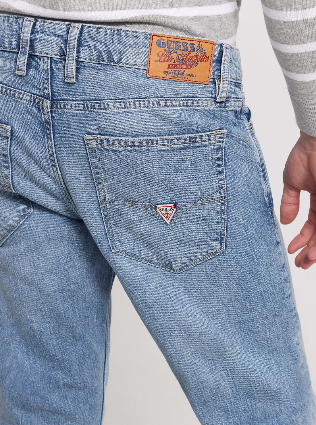 Low Rise Slim Tapered Denim Jeans in Light Wash